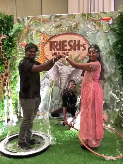 A happy couple enjoys a fun moment together as our bubble show creates a magical, bubbly explosion around them. It's a great interactive element for parties and celebrations.