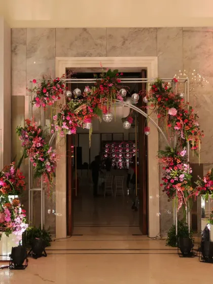 Your Mehendi should be a party. I designed this "Retro Disco" themed entrance with vibrant floral arrangements and sparkling disco balls to set a fun, high-energy tone from the moment guests arrived.