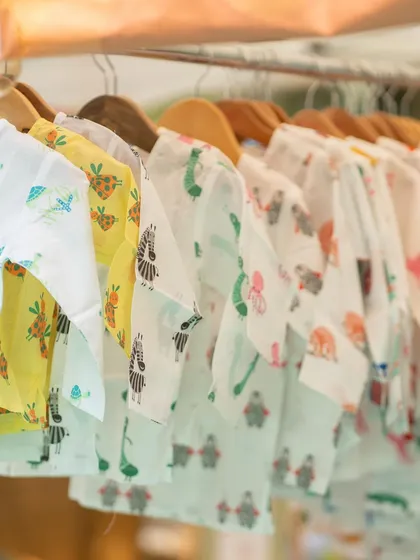 A close-up of soft, muslin Jablas with adorable animal prints. I focus on brands that use skin-friendly and organic materials, perfect for newborns and babies.