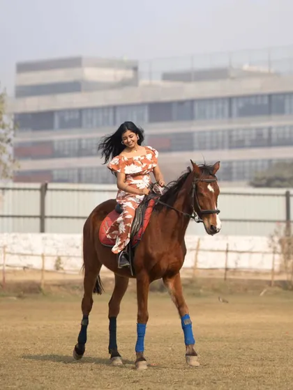 A model enjoys a ride in our open field. Our club is also a beautiful venue for photoshoots.