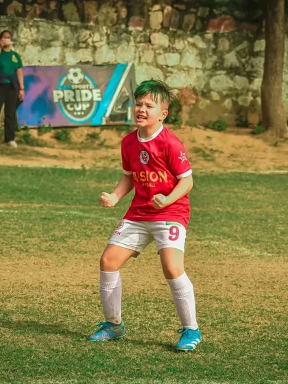 A player celebrates a goal with a roar of passion.