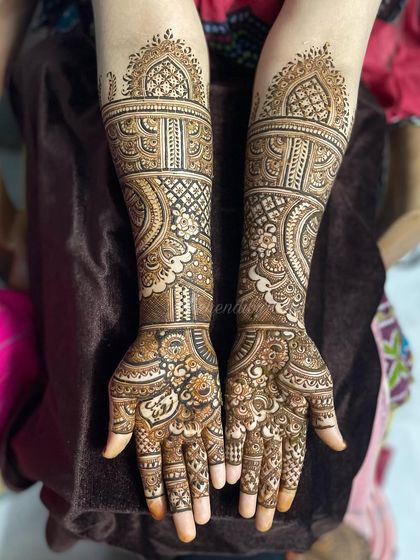 This is a great example of a traditional, full-coverage bridal mehendi. The design is dense with paisleys, flowers, and jaal work, leaving very little empty space for a very rich look.