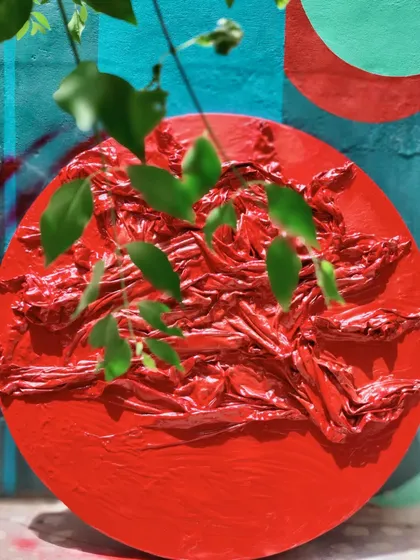 The finished red textured installation, a bold statement piece.
