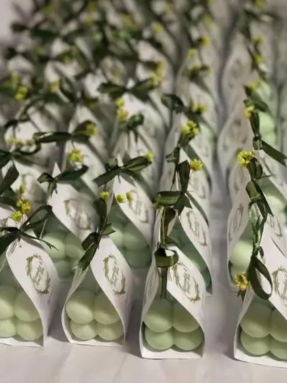 A different view of our baby bubble candles in their custom packaging. The personalized tag with the couple's initials adds a special touch to these adorable wedding favors.