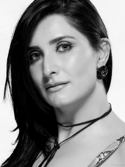 A classic black and white beauty headshot. The clean lighting and direct gaze make for a powerful and timeless portrait.