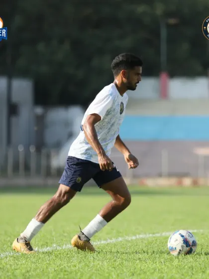 A player on the ball, demonstrating composure and control in the middle of the park.