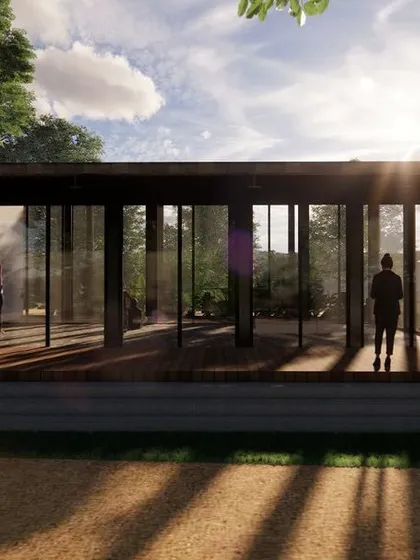 An exterior render of the proposed multipurpose hall, showing how the building sits lightly on the landscape. The raised deck and openable glass walls allow for a seamless transition between the indoor space and the natural surroundings.