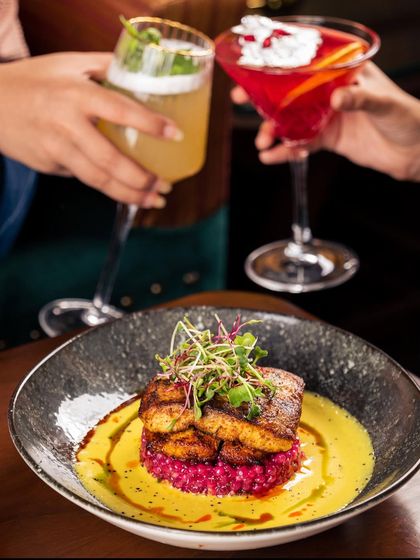Our Pan-Seared Fish is prepared with a South Indian touch, resting on a bed of beetroot sago in a tamarind malai coulis. It's a mosaic of tastes blending global culinary traditions.