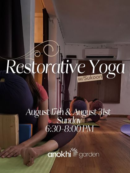 A student in a supported forward fold during a Restorative Yoga workshop. This practice focuses on ease and intentional rest, allowing the body to heal and the nervous system to unwind.