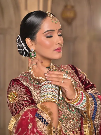 A close-up showcasing the soft, warm tones of the eye makeup and the radiant skin. I also styled her hair in an elegant bun, adorned with pearls, to complete this regal look.