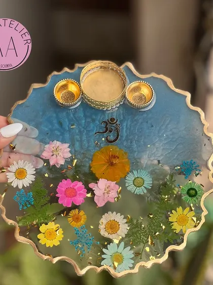 This sky blue floral pooja thali evokes a sense of peace and tranquility. Like all my thalis, it can be fully customized with different colors, flowers, and symbols.
