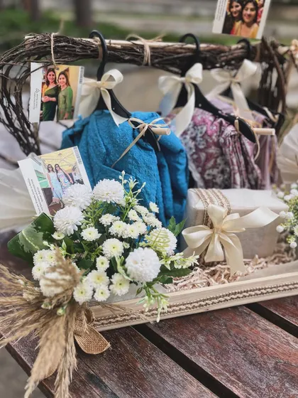 A close-up on the fresh white chrysanthemums and dried grasses used in the birthday hanger hamper. This detail highlights the soft, natural aesthetic I created for this summer-themed gift.