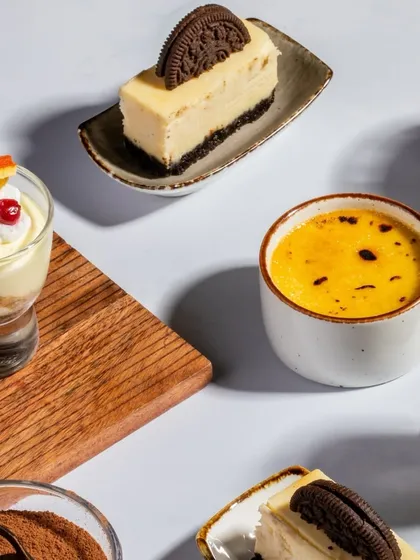 An assortment of our finest desserts, including Classic Tiramisu, Smoked Caramel Crème Brûlée, and Midnight Oreo Cheesecake. There's something for every sweet tooth.