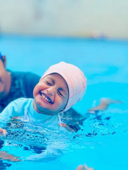 The pure joy of learning to swim. Our lessons are filled with laughter and positive reinforcement, making the pool a place where children feel happy and accomplished.