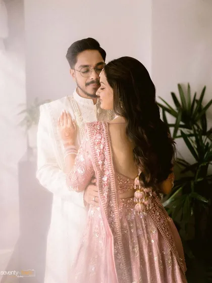A soft, dreamy portrait of the couple, with a hazy, light-filled effect that gives the image a romantic and ethereal quality.