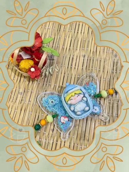 Another one of my adorable kids' rakhis. This one features a cute baby in a butterfly design, making it a sweet and memorable thread of love.