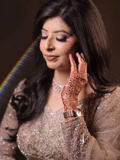 A beautiful, artistic portrait of Kanika on her engagement night. The soft makeup and lighting create a dreamy effect.