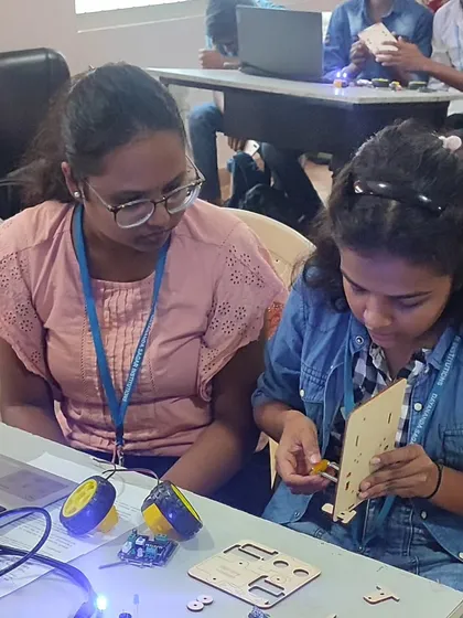 Our 'Robotics 101' workshops for college students are all about practical application. Here, engineering students are getting hands-on experience, assembling the chassis and wiring the electronics for their first robot, bridging the gap between theory and practice.