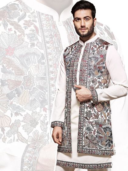 A masterpiece of floral embroidery. This open jacket, worn over a simple white kurta, showcases our dedication to intricate, artistic craftsmanship for a truly special occasion.