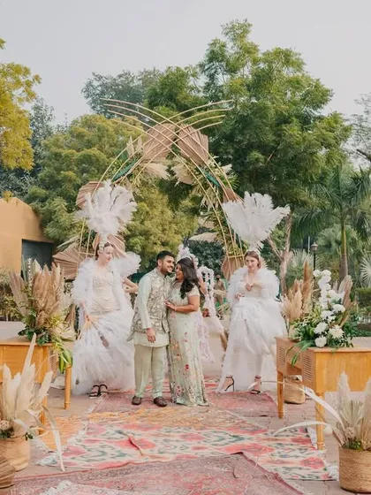 A wide shot of the couple at their unique 'Farmer's Market' event, surrounded by performers and beautiful decor.