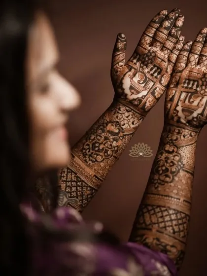 A lovely photo of a client with her engagement mehndi, which features classic elephant and architectural motifs.