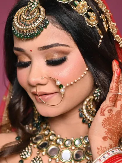 Another angle of the beautiful bridal makeup. This shot highlights the perfectly blended eyeshadow and the long, fluttery lashes that open up the eyes.