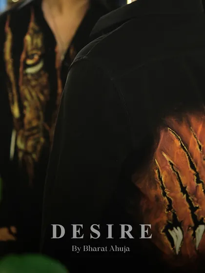 A final detail shot of the back of the tiger-print shirt, showcasing the dramatic and artistic claw-mark design.