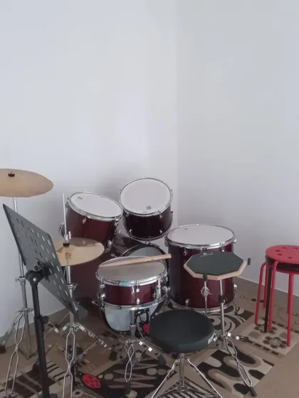 Our drum kit, ready for a student to come and find their rhythm.