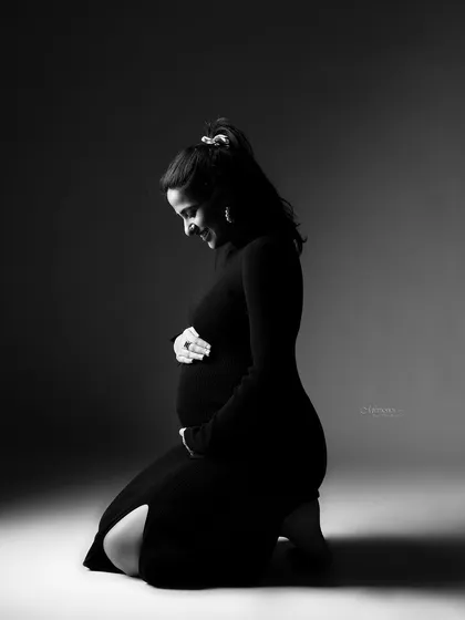Soft smiles, strong love. The beauty of motherhood is captured in this quiet, intimate black and white moment.