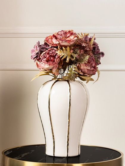 For a more dramatic look, I offer this artificial peony bouquet in deep, moody shades of burgundy and purple. It's a sophisticated choice for an elegant and modern interior.