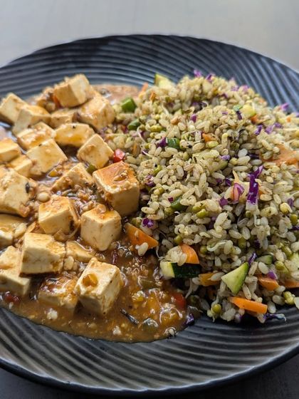 Our pesto-flavored brown rice served with tofu in a garlic pepper sauce. This dish demonstrates our ability to create delicious and satisfying plant-based meals that are rich in protein and complex carbs.