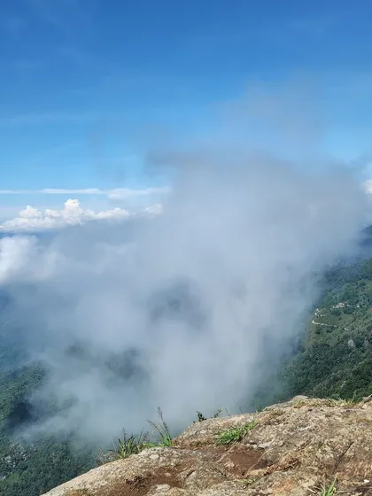 Clouds rolling in over the mountains, a common and magical sight on our hill station trips.
