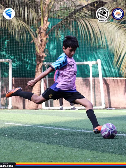 A player strikes the ball with power and precision. This is the result of dedicated practice and expert coaching.