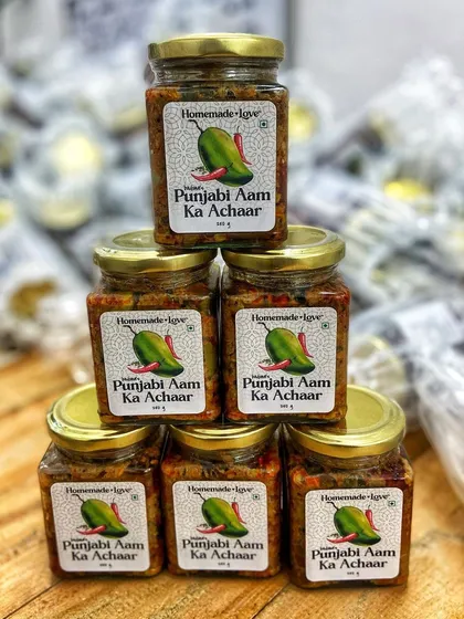 Stacks of our most loved pickle, ready to be sent to your homes. Each jar of our Punjabi Aam ka Achaar is filled with the authentic taste of a mother's love.