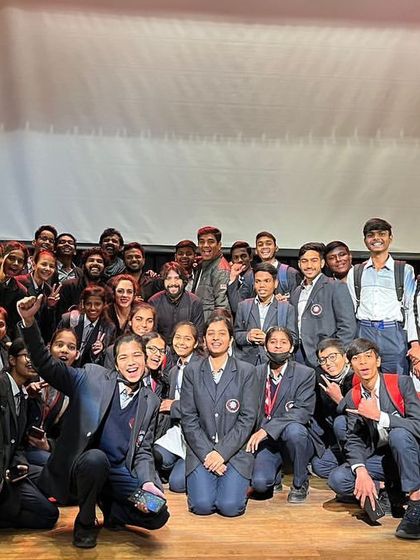 The entire 'Buried Treasures' team with a group of students after a special performance. We are passionate about bringing theatre to young audiences and fostering a love for the arts.