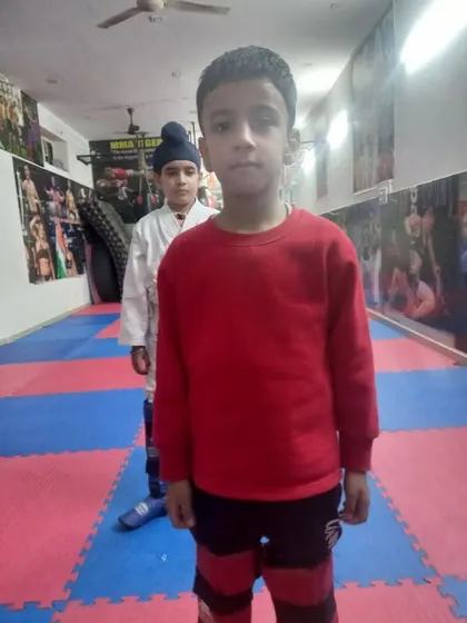 Two of my youngest students standing with focus and discipline in the training hall. The journey to becoming a martial artist starts here.