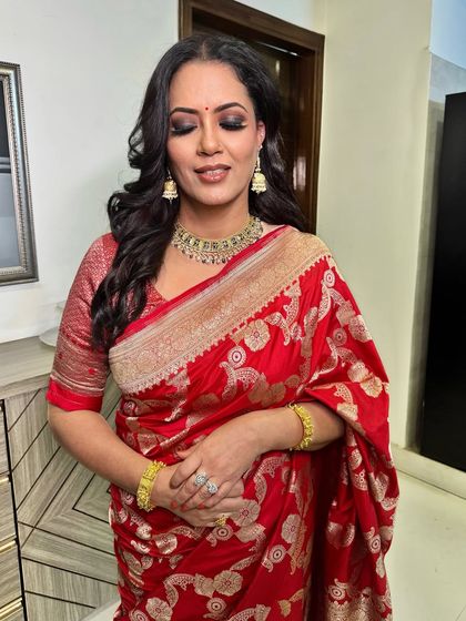 Celebrating my incredible mother-in-law on her birthday. I gave her a classic look with a smokey eye and a red lip to match her beautiful Banarsi saree.