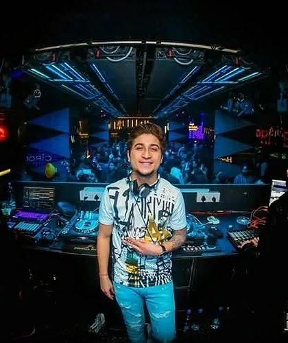 A great photo from behind the console, showcasing the impressive tech setup and the view of the dance floor. This is where the magic happens.