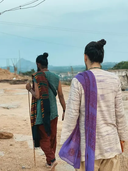 This is a duplicate of image 83. Teacher and student walking the path together, a powerful metaphor for the journey of yoga.