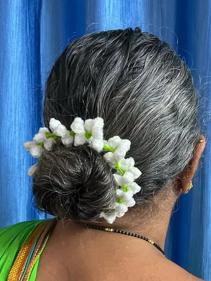 This is my Aaji, the inspiration behind my craft, wearing a traditional jasmine gajra I crocheted for her. Seeing her smile is my greatest reward and it’s why I love making these timeless pieces.