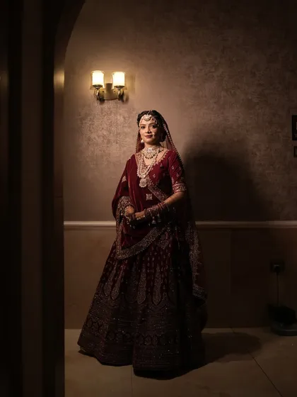 My beautiful Rajwada bride in her full glory. The deep maroon lehenga and heavy jewellery required a makeup look that was both strong and elegant.