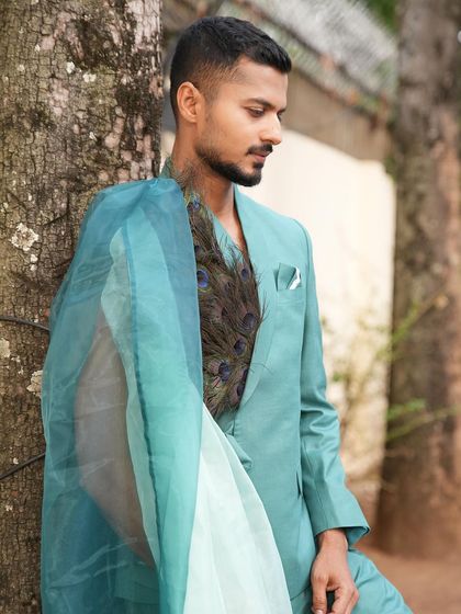 Leaning against a tree, this pose creates a story and adds a soft, thoughtful mood to the image.