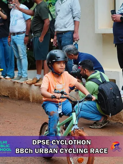 A young cyclist shows intense focus during the Urban Cycle Race. I create courses that are challenging yet accessible for young riders to build their skills and confidence.