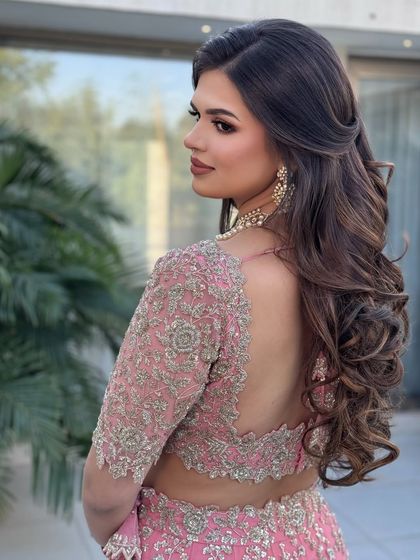 Glamour in every glance with this soft half-up style.