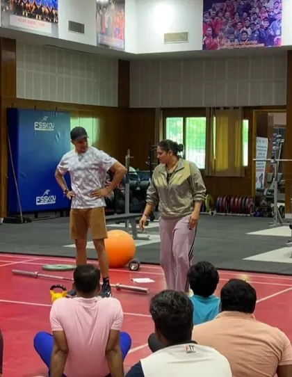 In conversation with a coach during a workshop. These one-on-one interactions are where we can dive deep into specific challenges and questions.