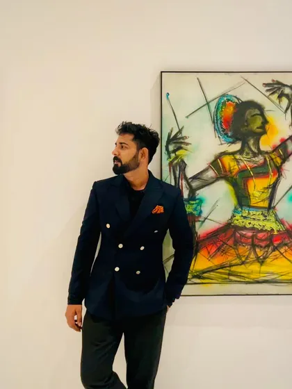 Posing next to a vibrant painting. I draw inspiration from all forms of art, and being surrounded by the work of other artists always ignites my own creative energy before a performance.