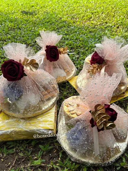 A collection of four exquisitely wrapped gift platters, ready to be gifted for Diwali or any other celebration.