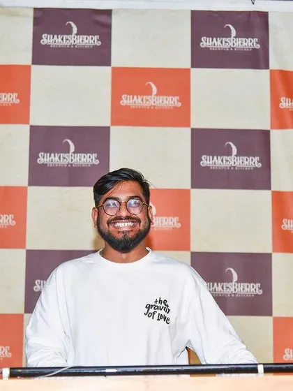 Posing for a quick photo before my set at Shakesbierre. Ready to spin a mix of Top 40, Bollywood, and Punjabi music for the weekend crowd.