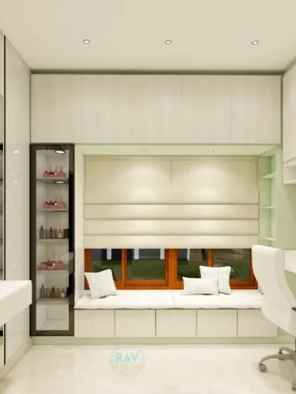 A well-designed corner of a kids' room, featuring a study desk, a vanity, and a window seat, all in a clean white finish.
