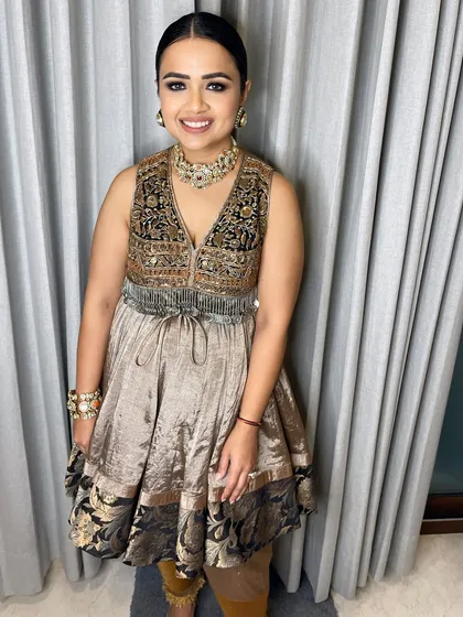 Cocktail glam on! This client is ready for her event with defined smokey eyes, glowing skin, and a sleek updo that highlights her beautiful features.